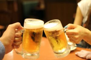 people toasting beer